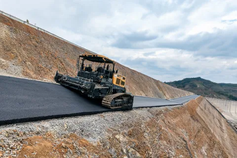 Dam embankment access road paving