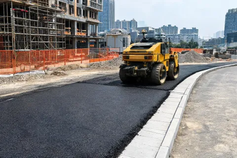 Urban building-site access road paving